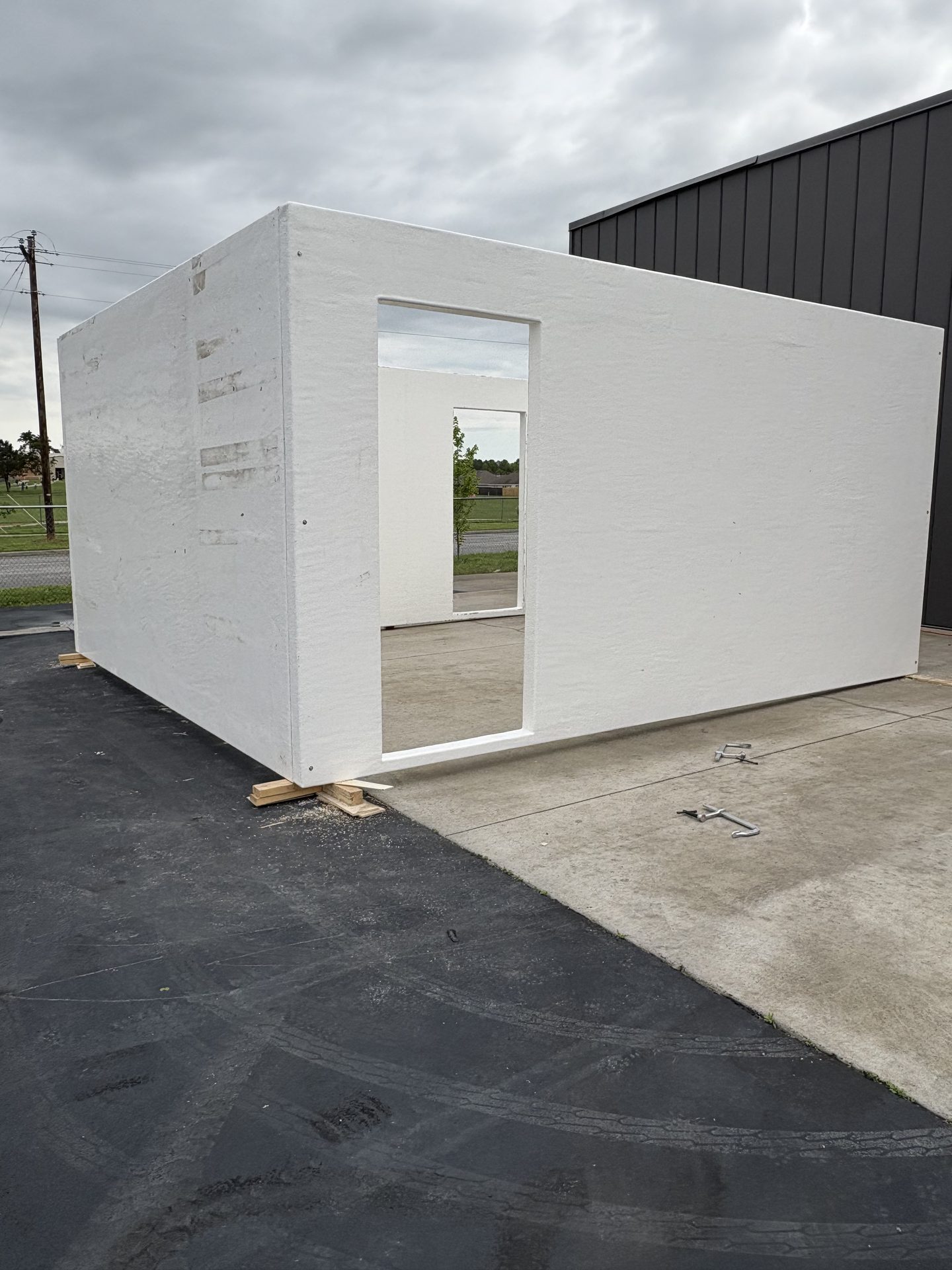 Modular fiberglass building with doorway cut
