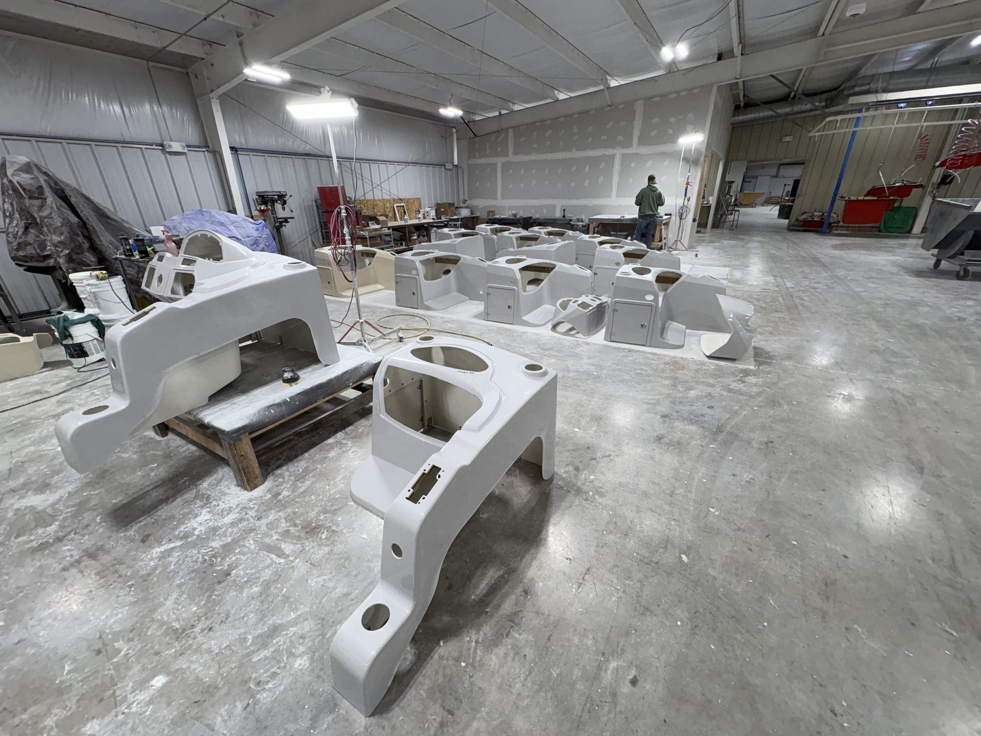 Molded components spread across the shop floor
