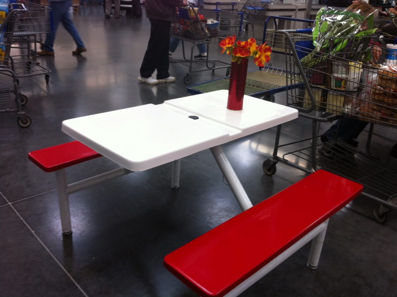 White fiberglass picnic table with red benches