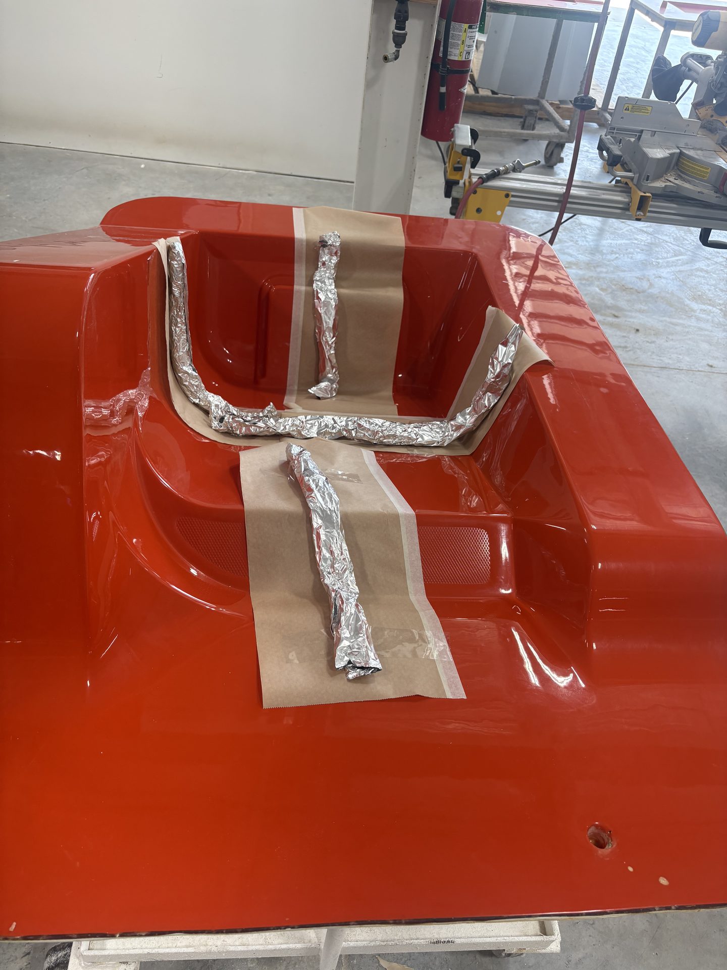 Red fiberglass hood with molded scoop