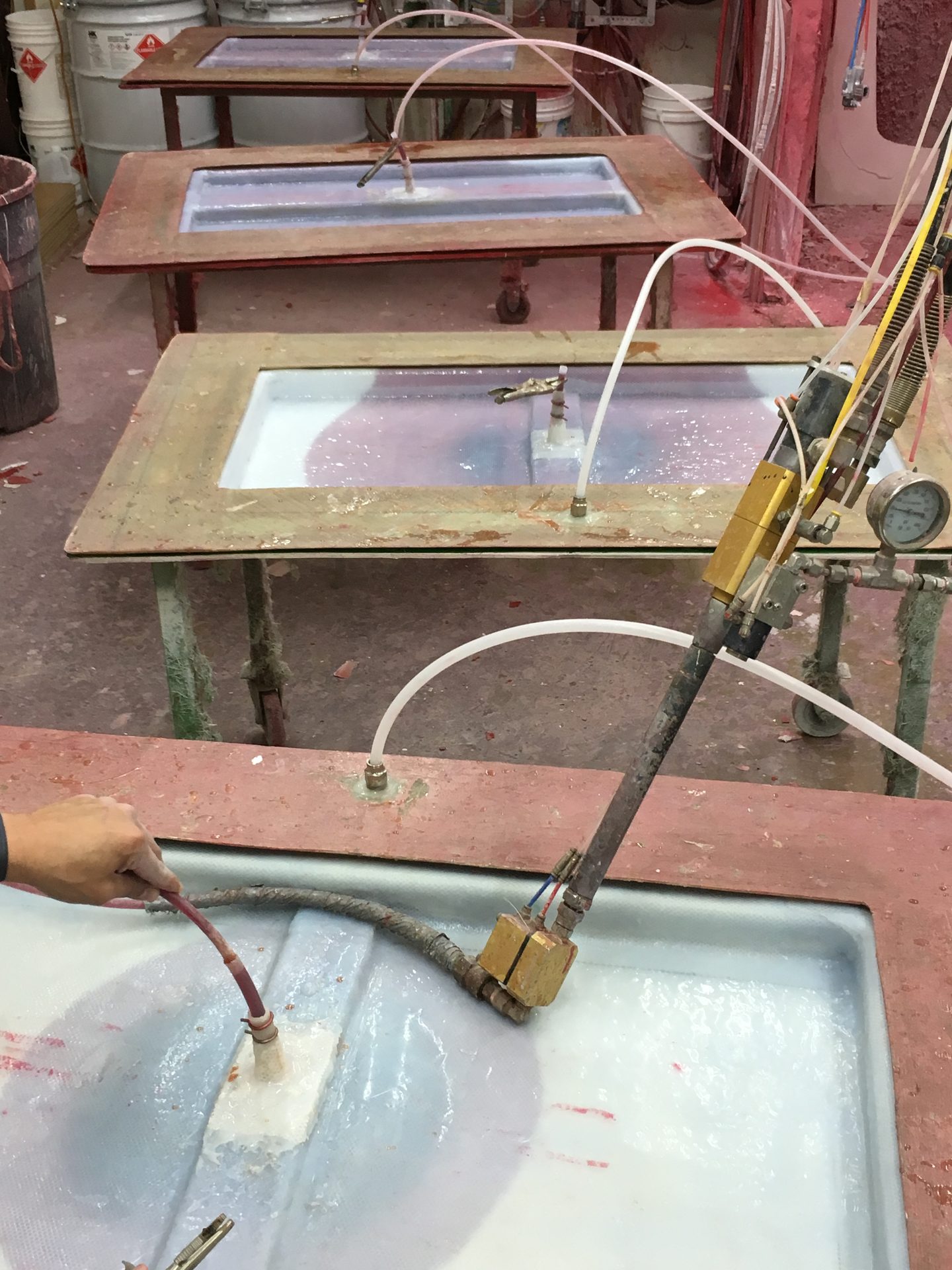 Close-up of resin feed lines into a mold