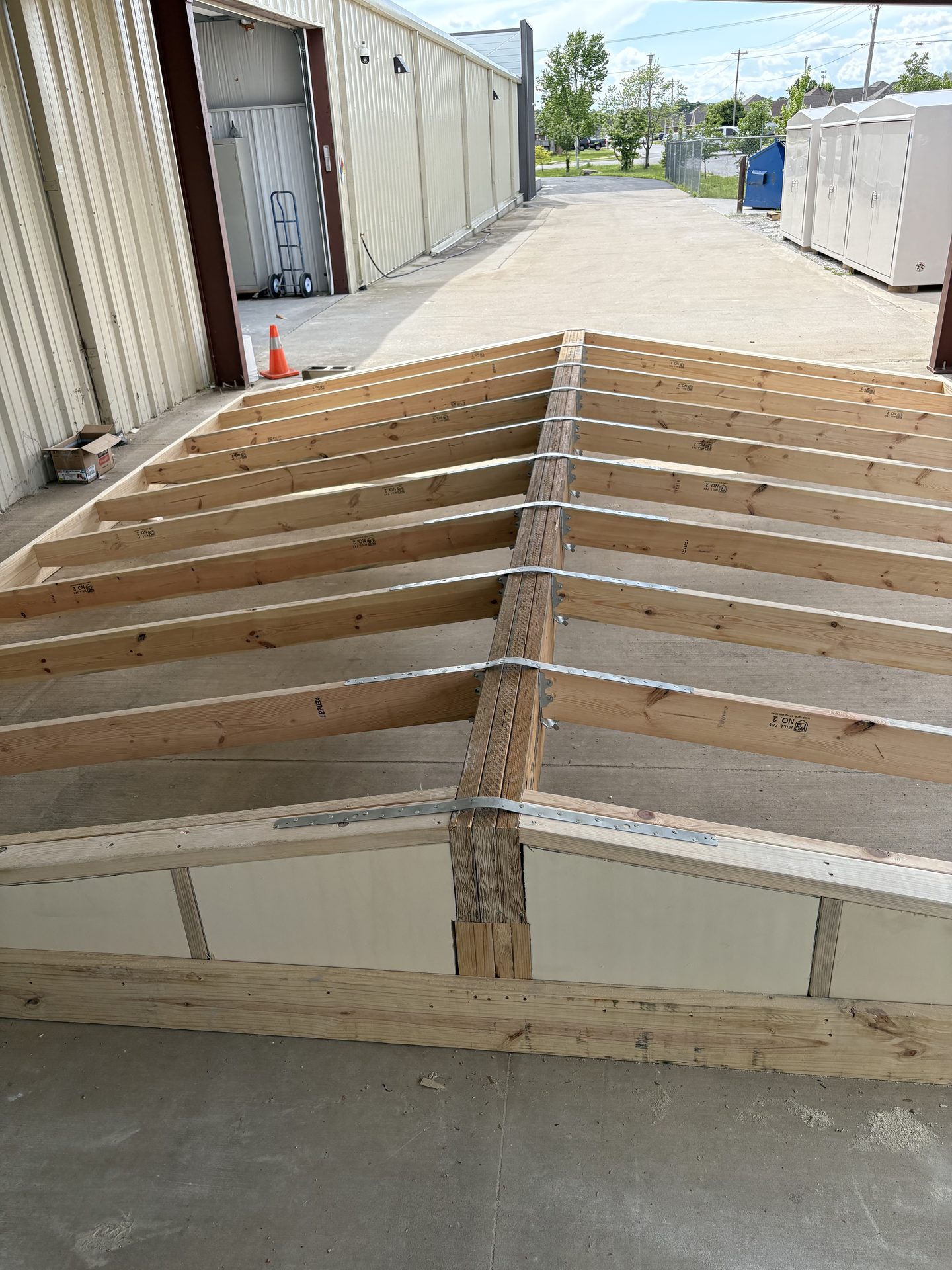 Roof framing over fiberglass panels