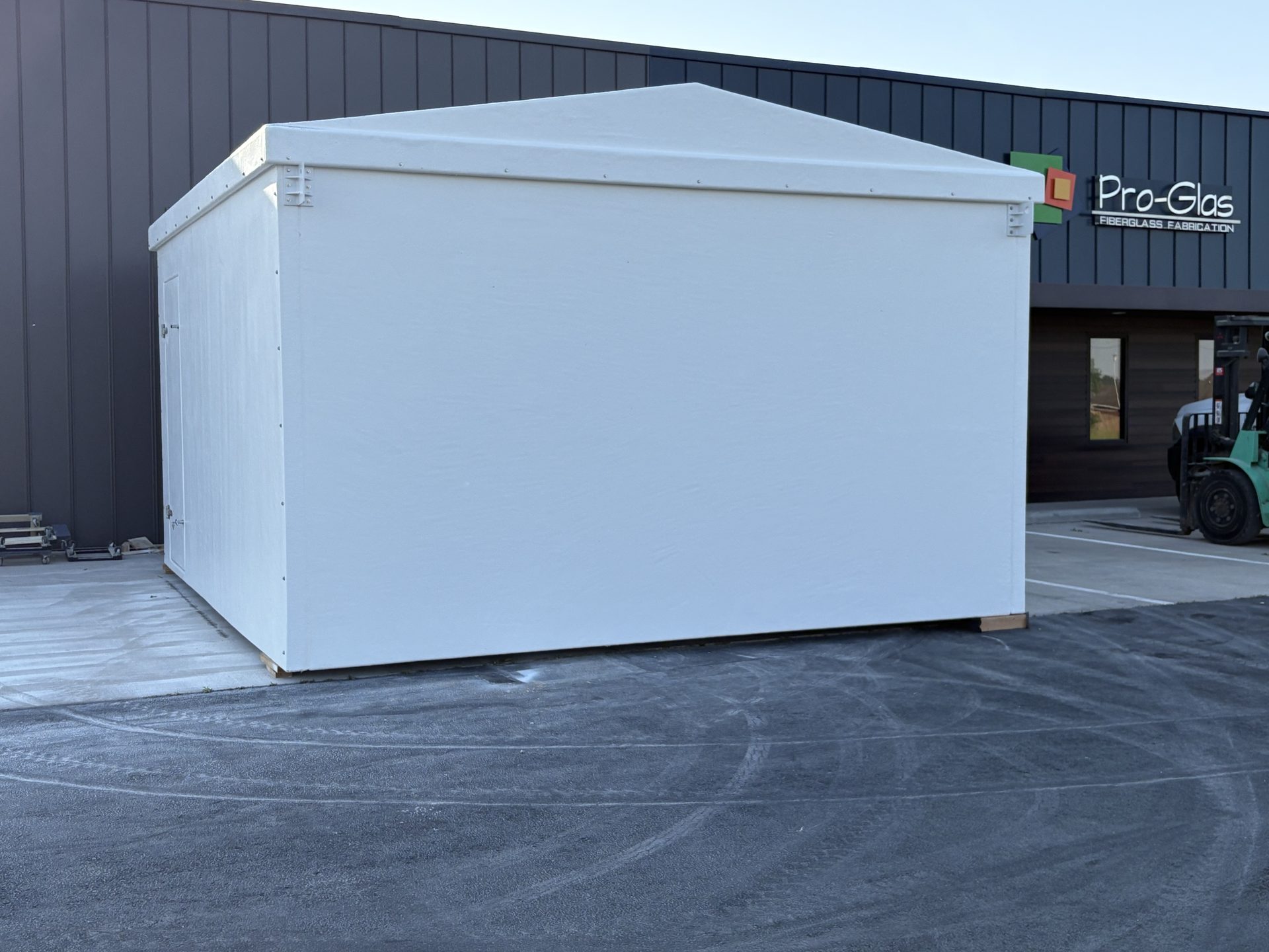 Finished white fiberglass modular building outside the Pro-Glas facility