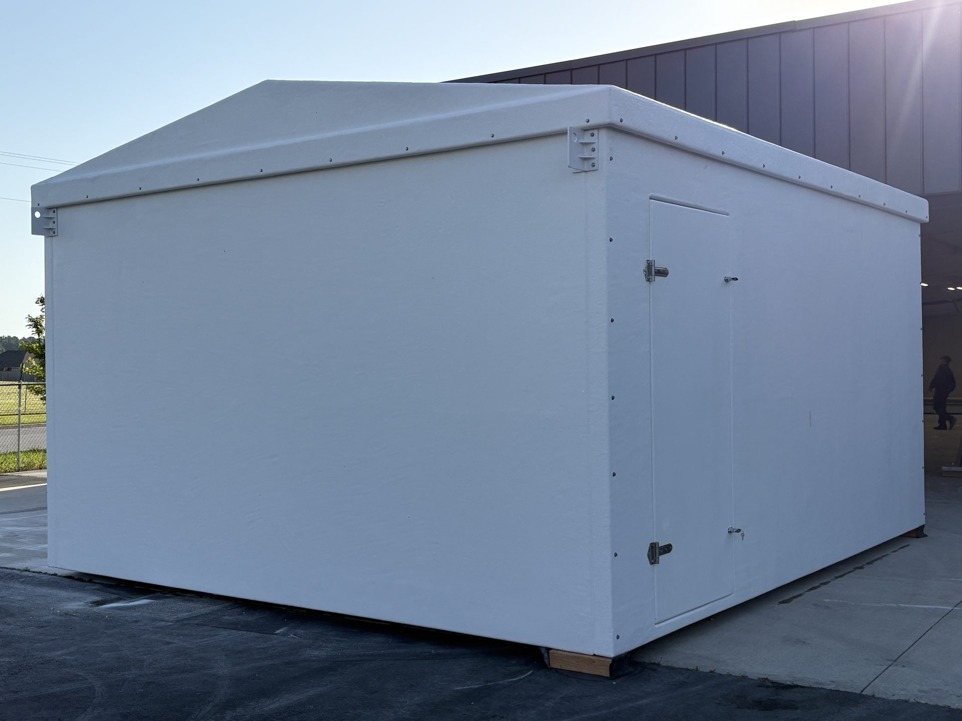 Completed fiberglass shelter with door hardware